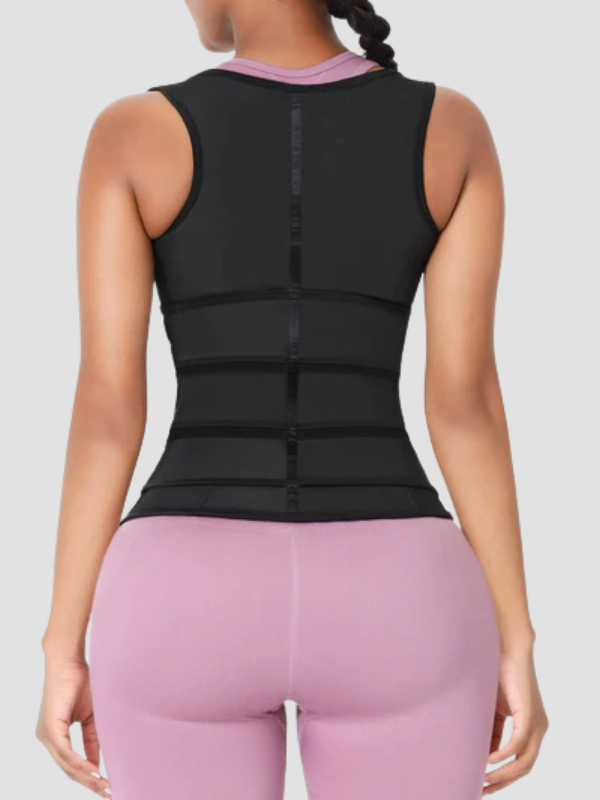 Back view of woman wearing a black triple-belt waist trainer vest over pink workout leggings, designed for full back support and body shaping.
