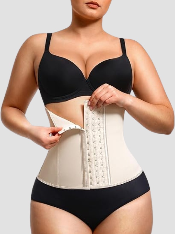 Curvy woman wearing beige latex waist trainer corset with hook-eye closure and adjustable compression layer for shaping and tummy control.