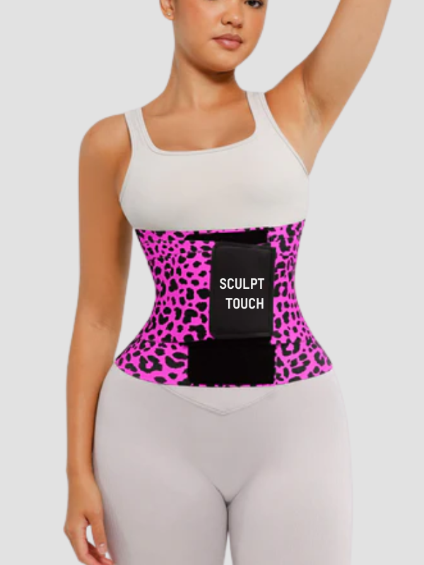 Model wearing a pink leopard print SCULPT TOUCH triple wrap waist trainer belt for tummy control and waist shaping.