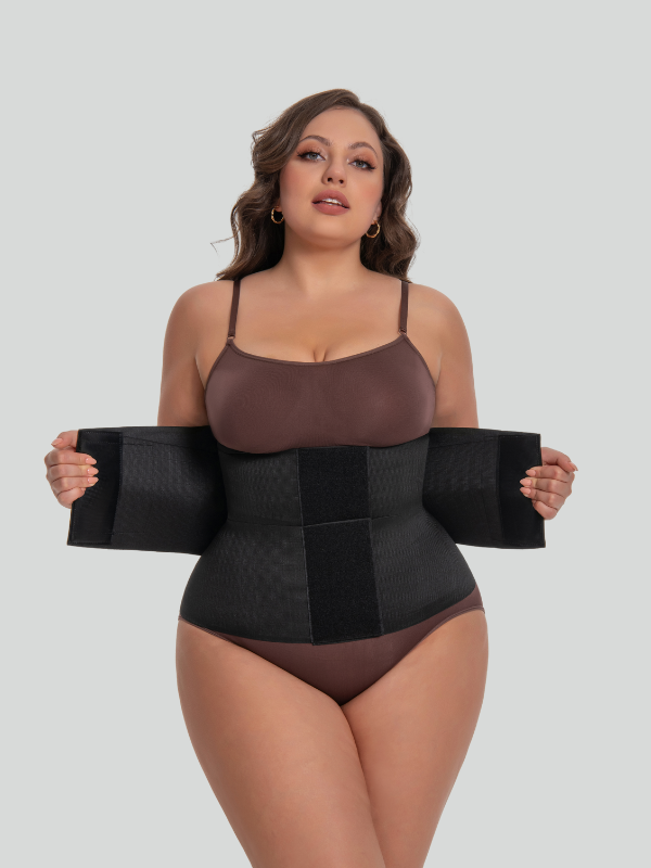 Model showing curve-enhancing effect of long torso girdle under dress