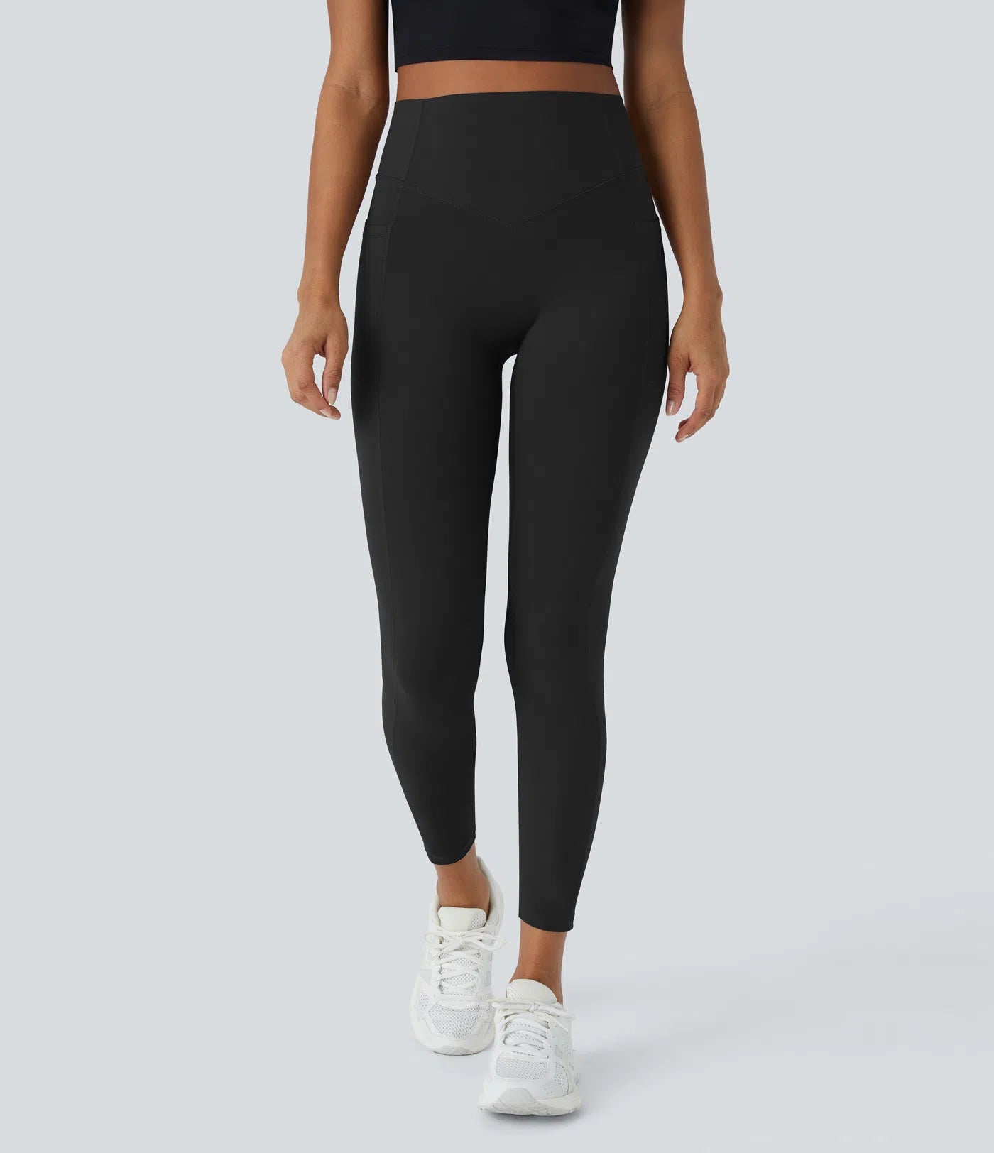 Model wearing black BBL leggings with high stretch and snug fit, perfect for workouts and daily wear.
