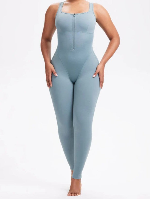 Full-length front shot of model in sauna bodysuit leggings designed to flatten abdomen and enhance curves.