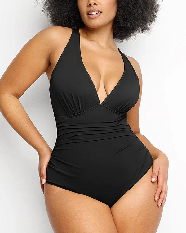Front view of shaping swimsuit with deep V-neck and slimming fit