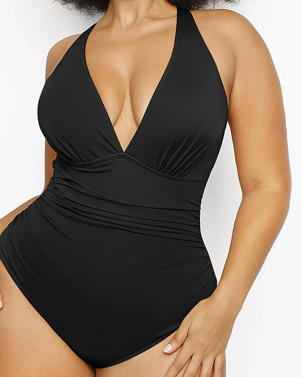 Woman posing in plunge cutout swimwear with wide supportive straps
