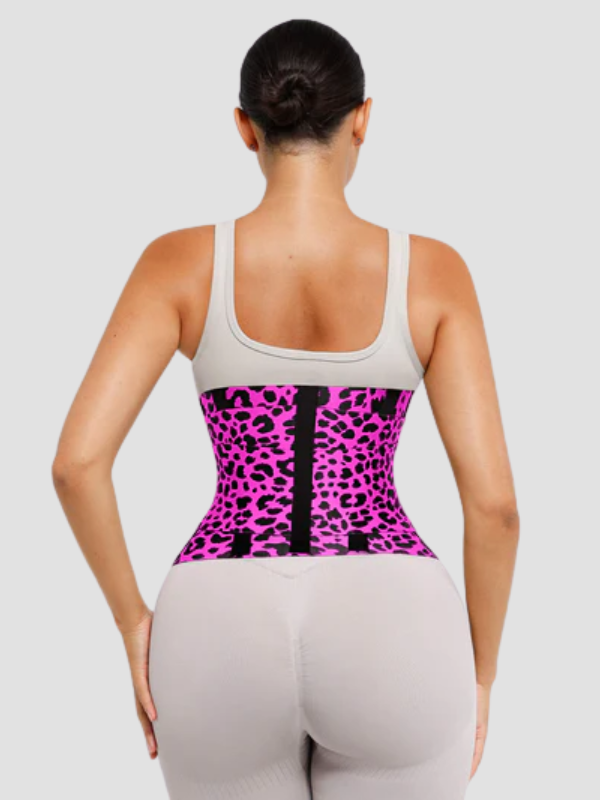 Rear view of model in pink leopard SCULPT TOUCH waist trainer, showcasing snug fit and adjustable triple-strap for enhanced waist sculpting.